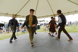 A group of people dancing in a marquee