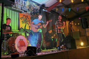 Four people playing on a stage.