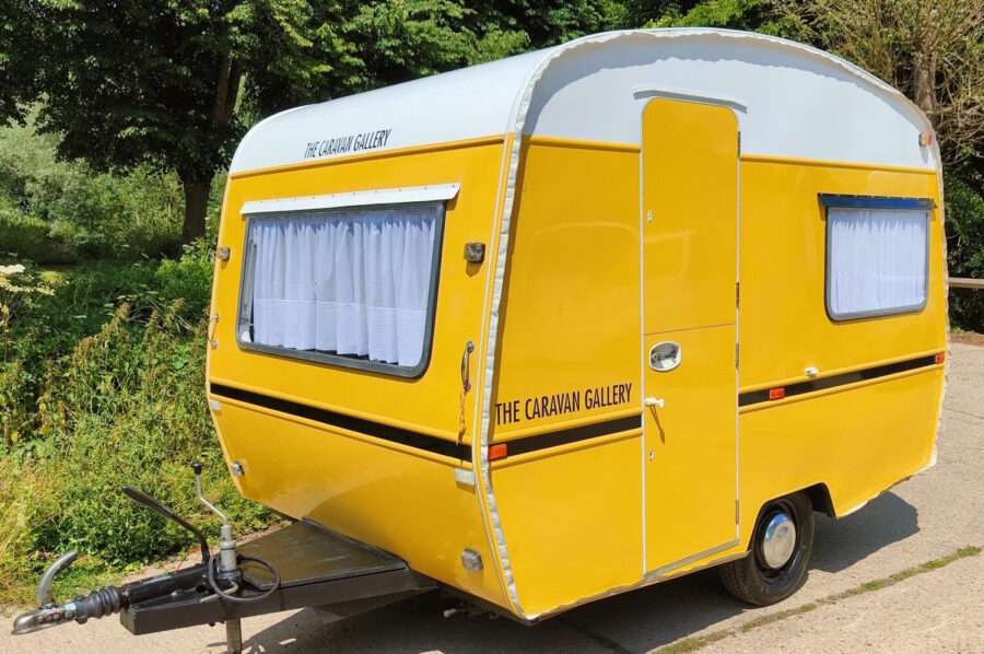 A yellow caravan.